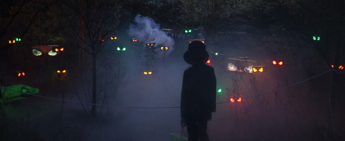 Creepy eyes and fog decorations coming from the woods