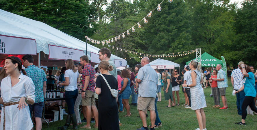 Red, White, and Zoo stations with sponsor tabling