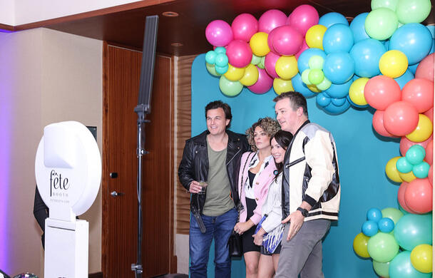 A photobooth with a printer so guests could take home branded pictures from the event