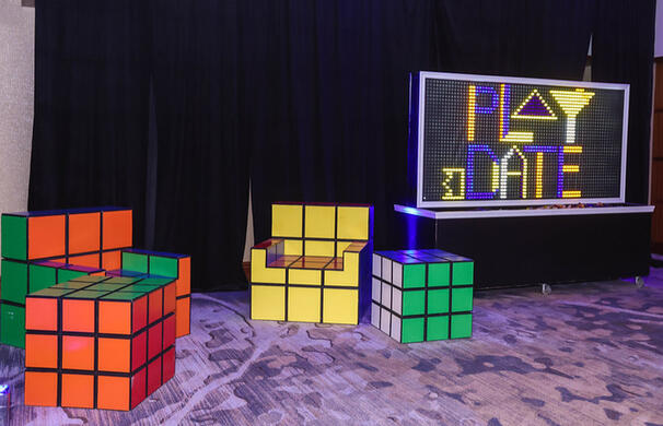 A Lite-Brite inspired interactive decoration and Rubik&#39;s cube chairs for fun photo ops