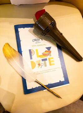 Printed programs were accompanied by feather pens and light up torches for the auction and fund-a-need