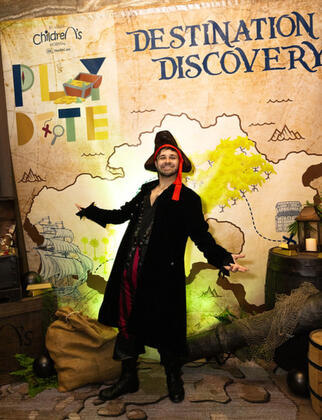 Custom-made treasure map to represent the island and a pirate character actor to take photos with guests