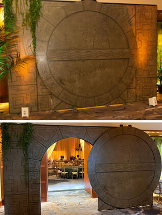 A character actor dressed as Indiana jones made a big show of opening the “hidden” door for the call to dinner