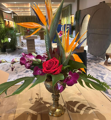 Goblets to represent the Holy Grail and tropical flowers